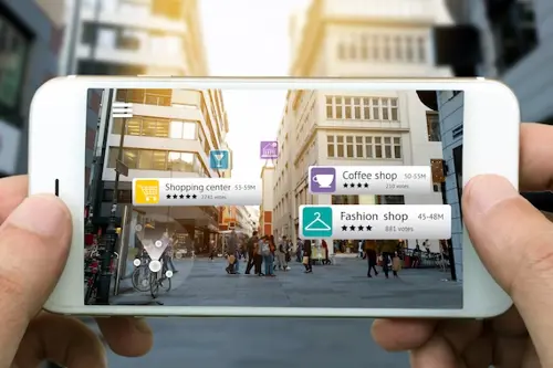 Smartphone being used to display augmented reality storefronts with the reviews on the screen.